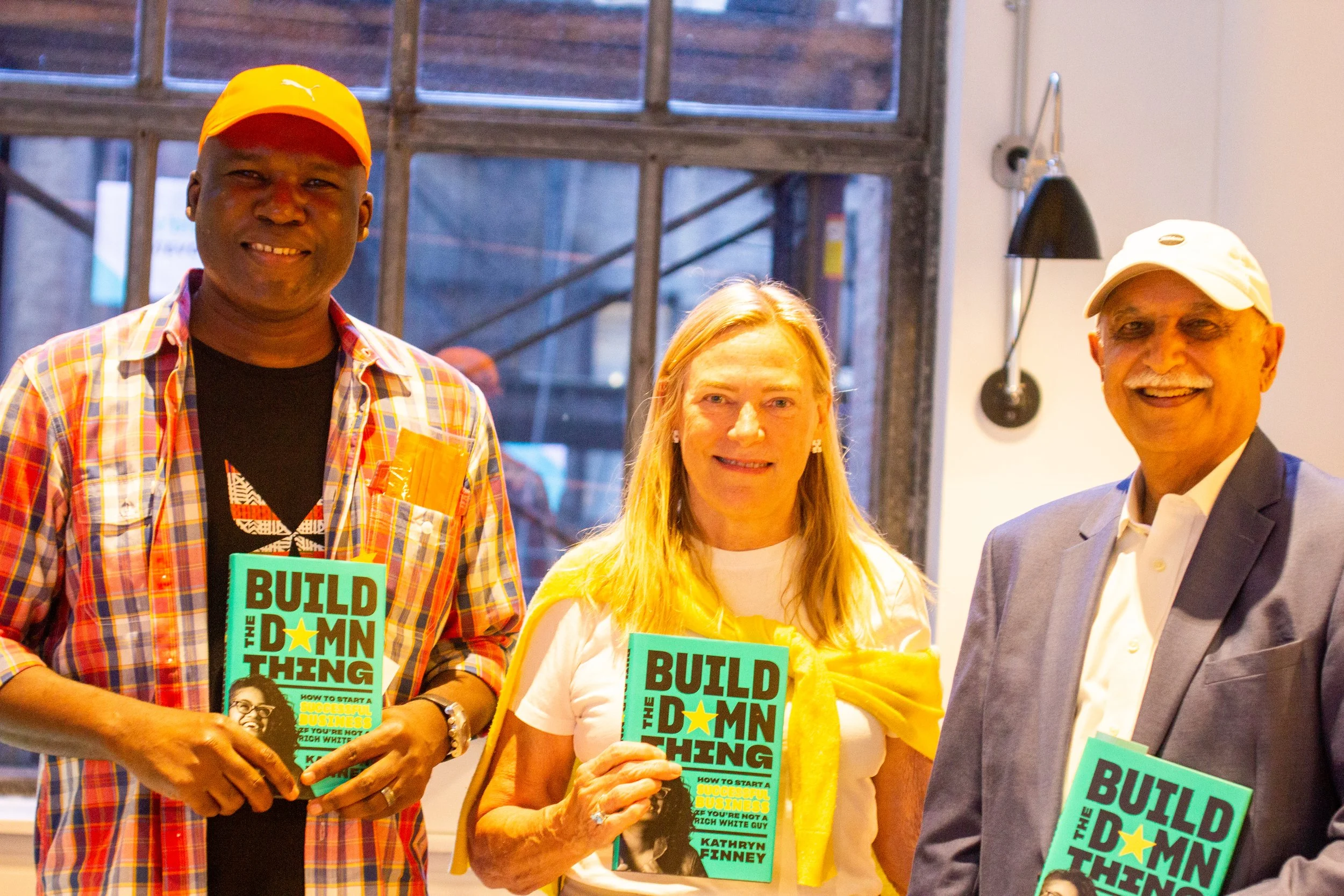 Readers holding Build the Damn Thing in New York