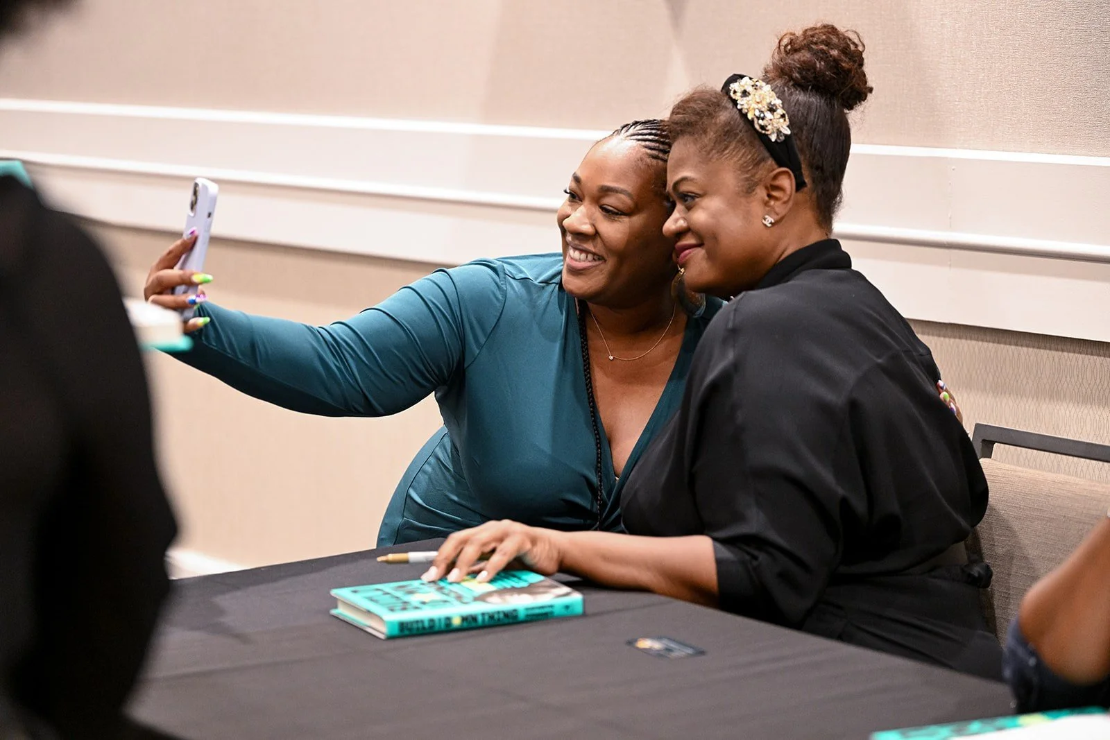 Kathryn Finney signing books at a tour event